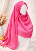 Pink hijab on a mannequin head with a soft background