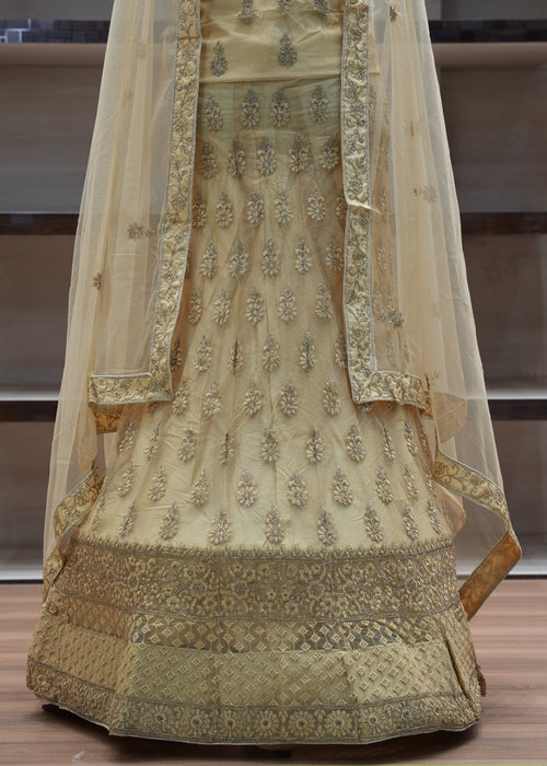 Decorative traditional outfit with intricate patterns on a wooden floor.