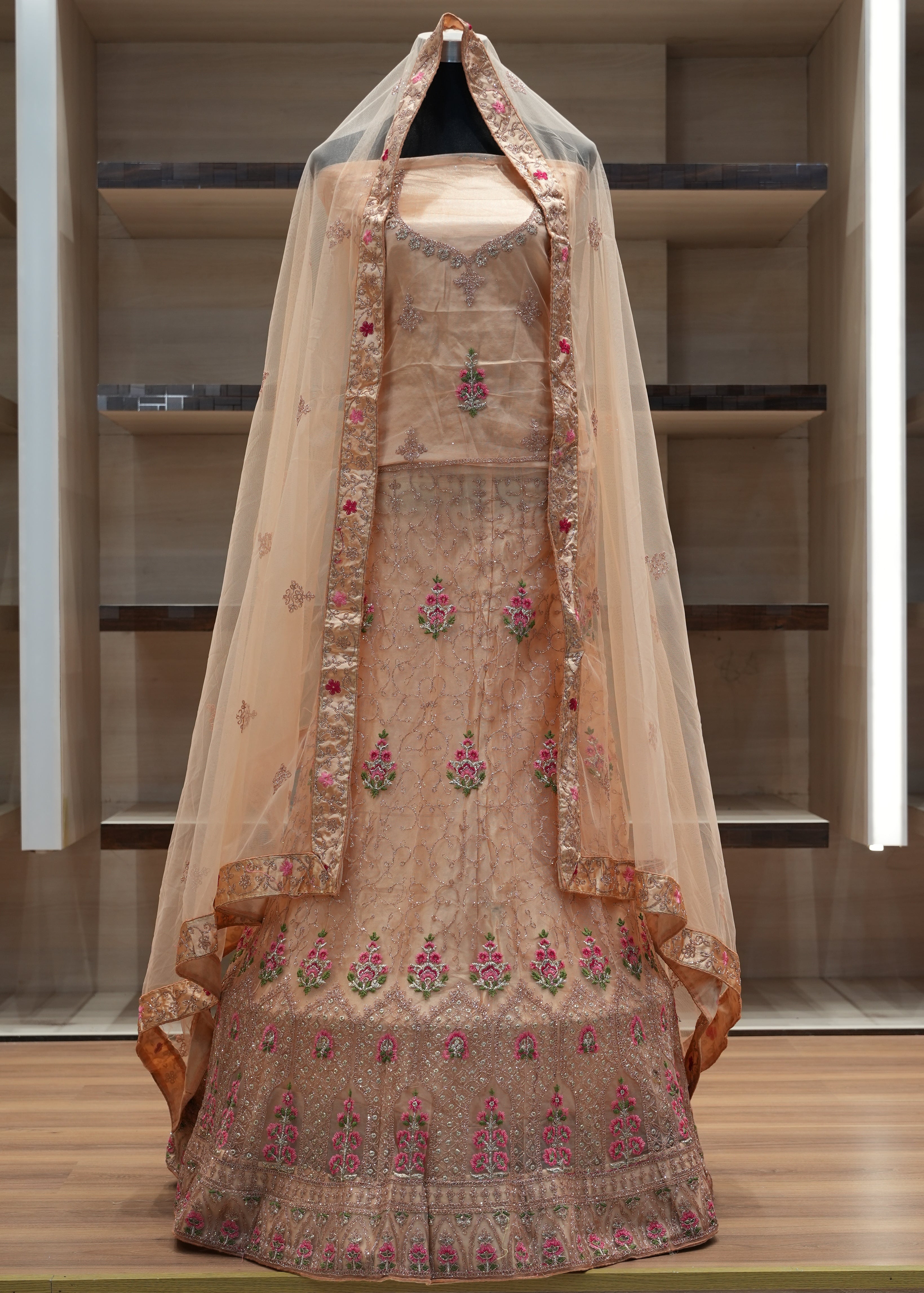 Traditional embroidered garment on a wooden surface with a neutral background