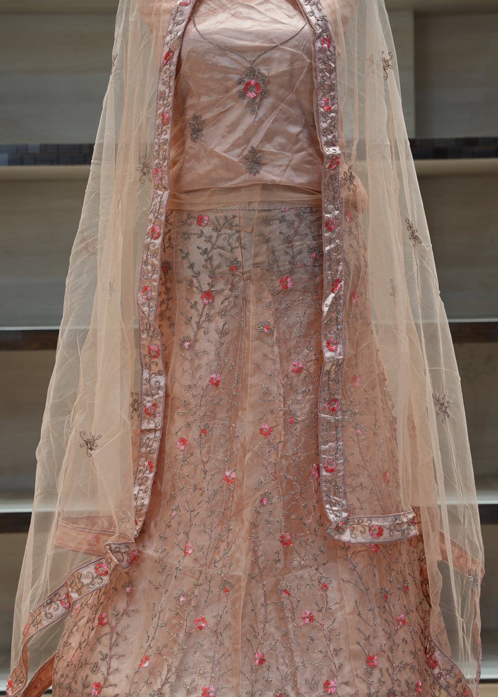 Decorative fabric with floral patterns draped over a surface