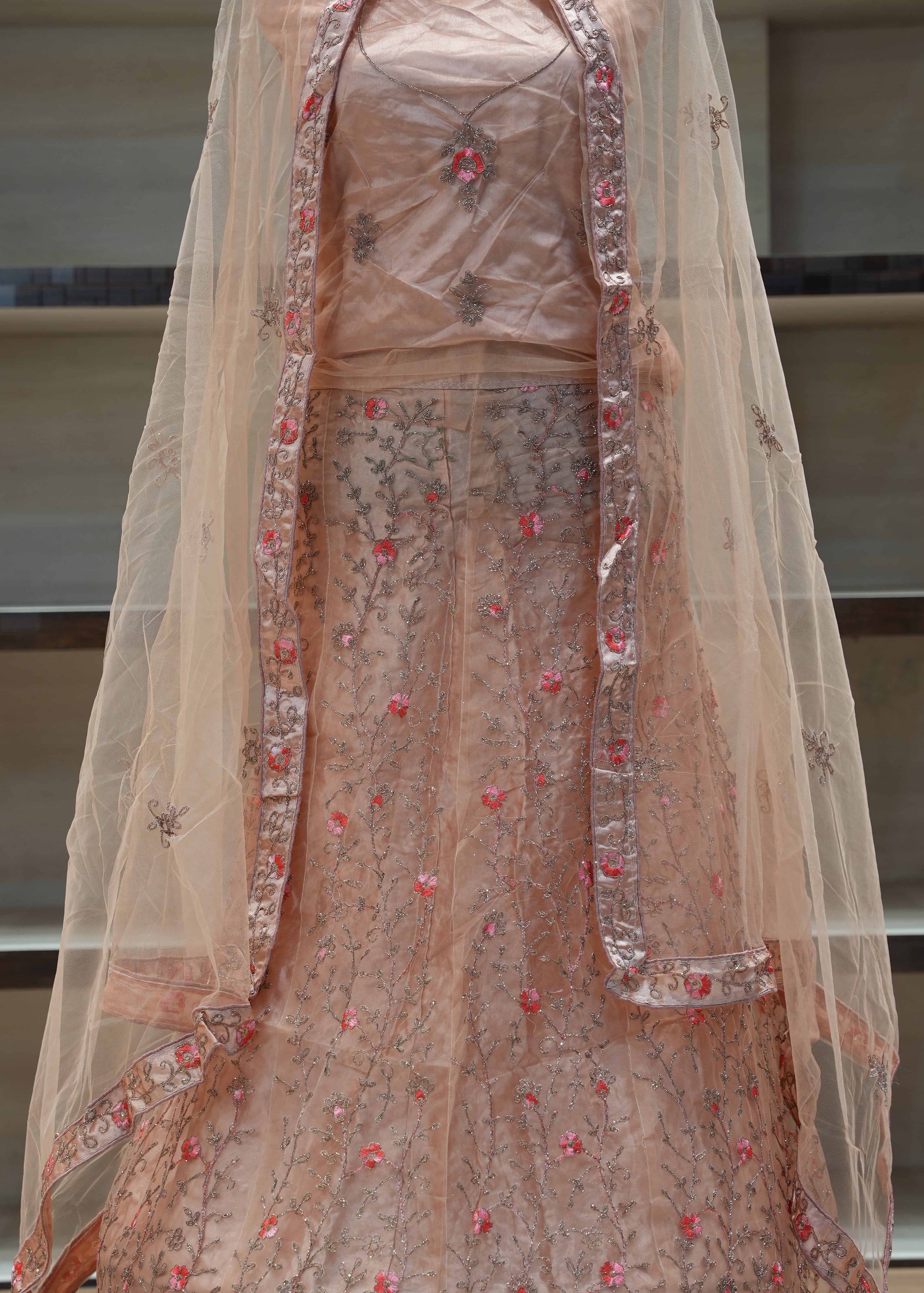 Decorative fabric with floral patterns draped over a surface