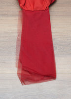 Red fabric on a wooden surface