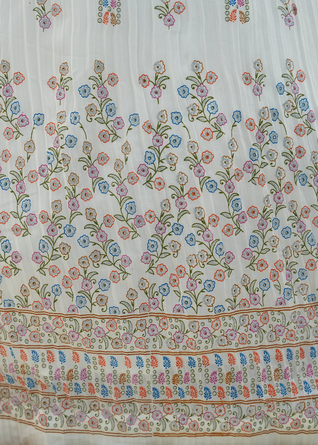 Floral patterned fabric with colorful flowers on a white background