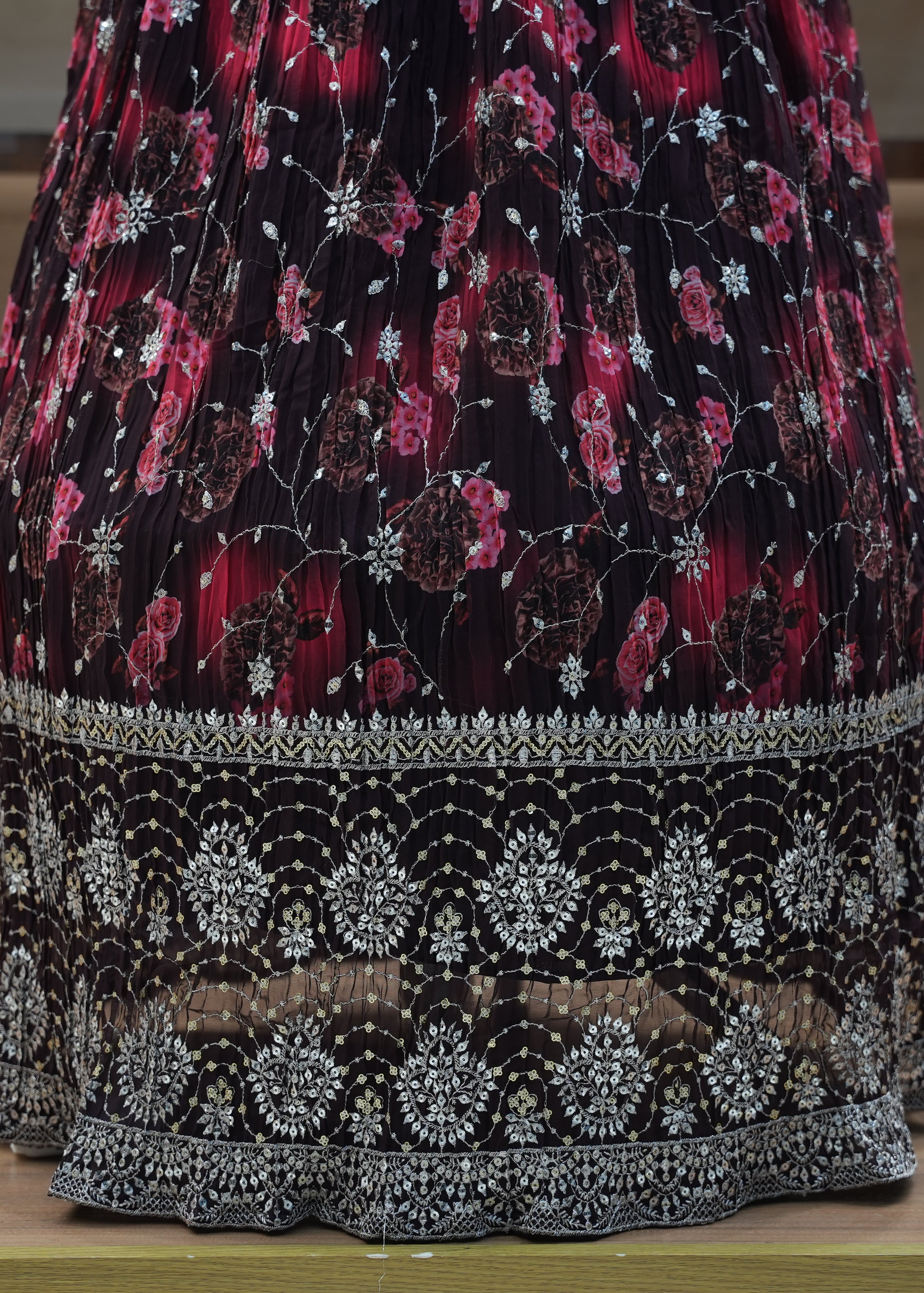 Decorative skirt with floral pattern on a wooden floor