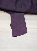Purple fabric on a wooden surface