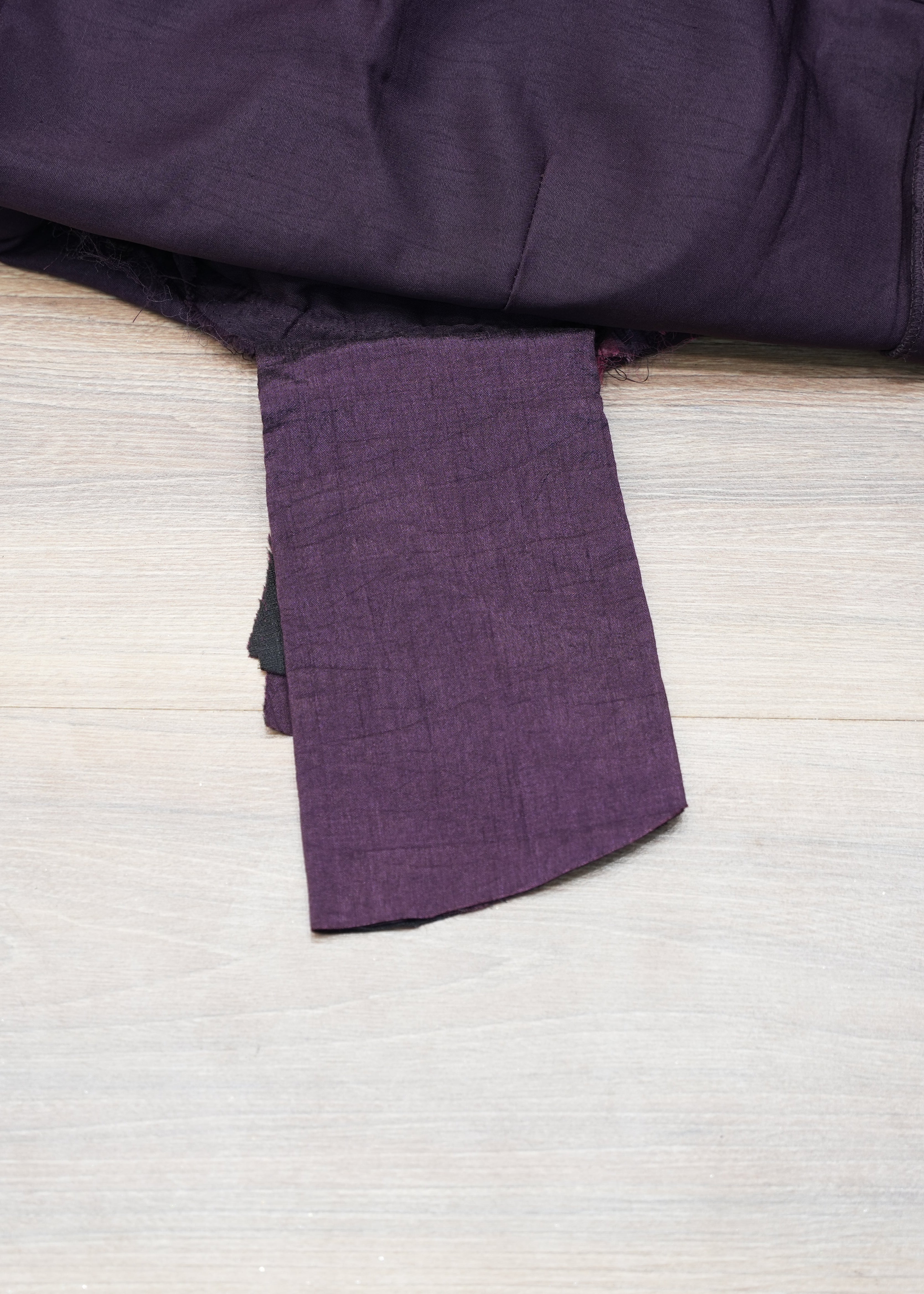 Purple fabric on a wooden surface