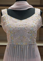 Embroidered dress on a mannequin with a blurred background