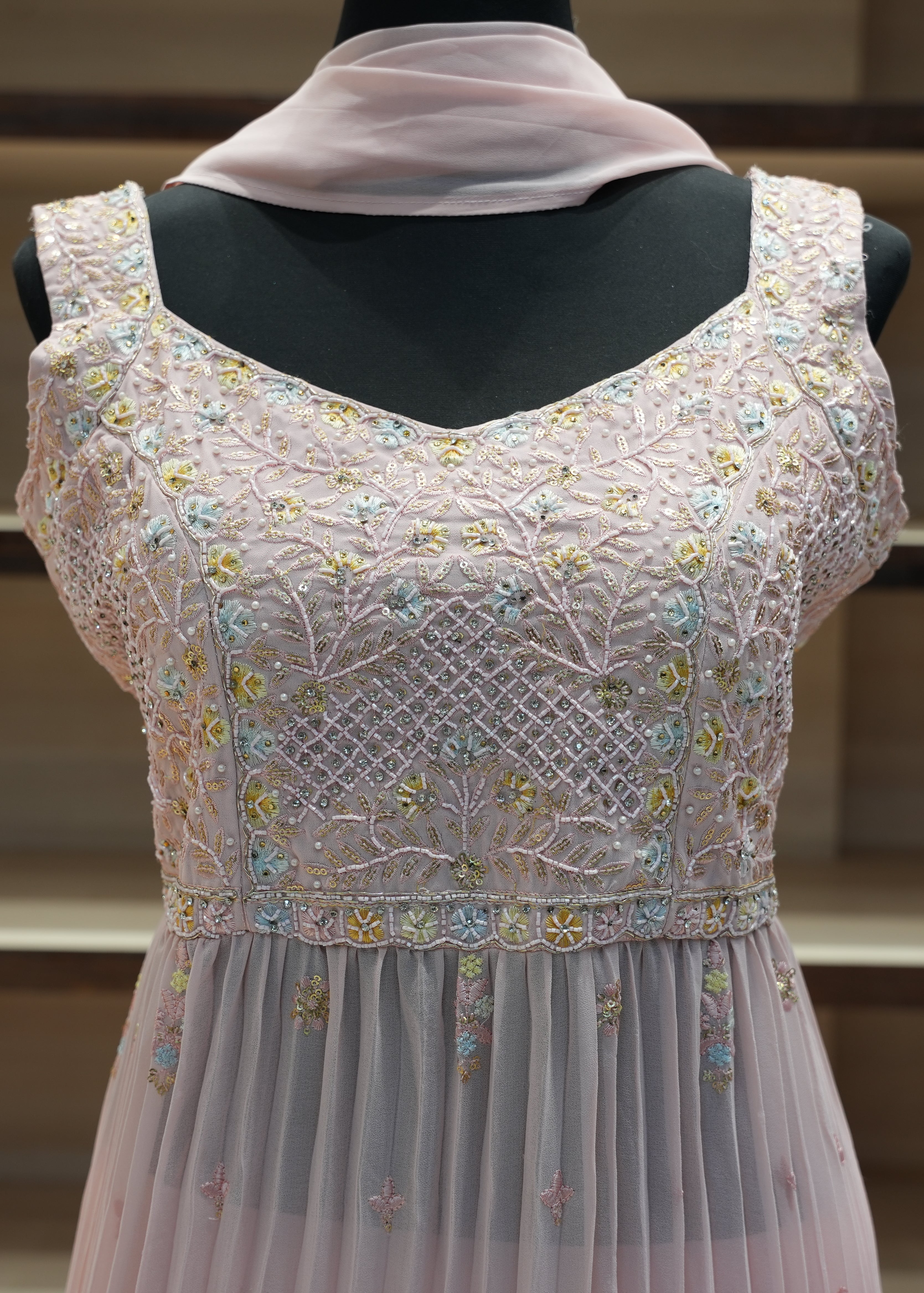 Embroidered dress on a mannequin with a blurred background