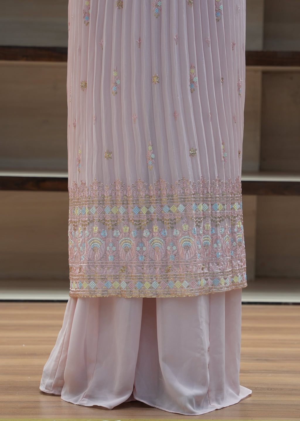 Decorative table runner with intricate patterns on a wooden table.