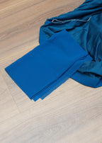 Blue fabric on a wooden floor