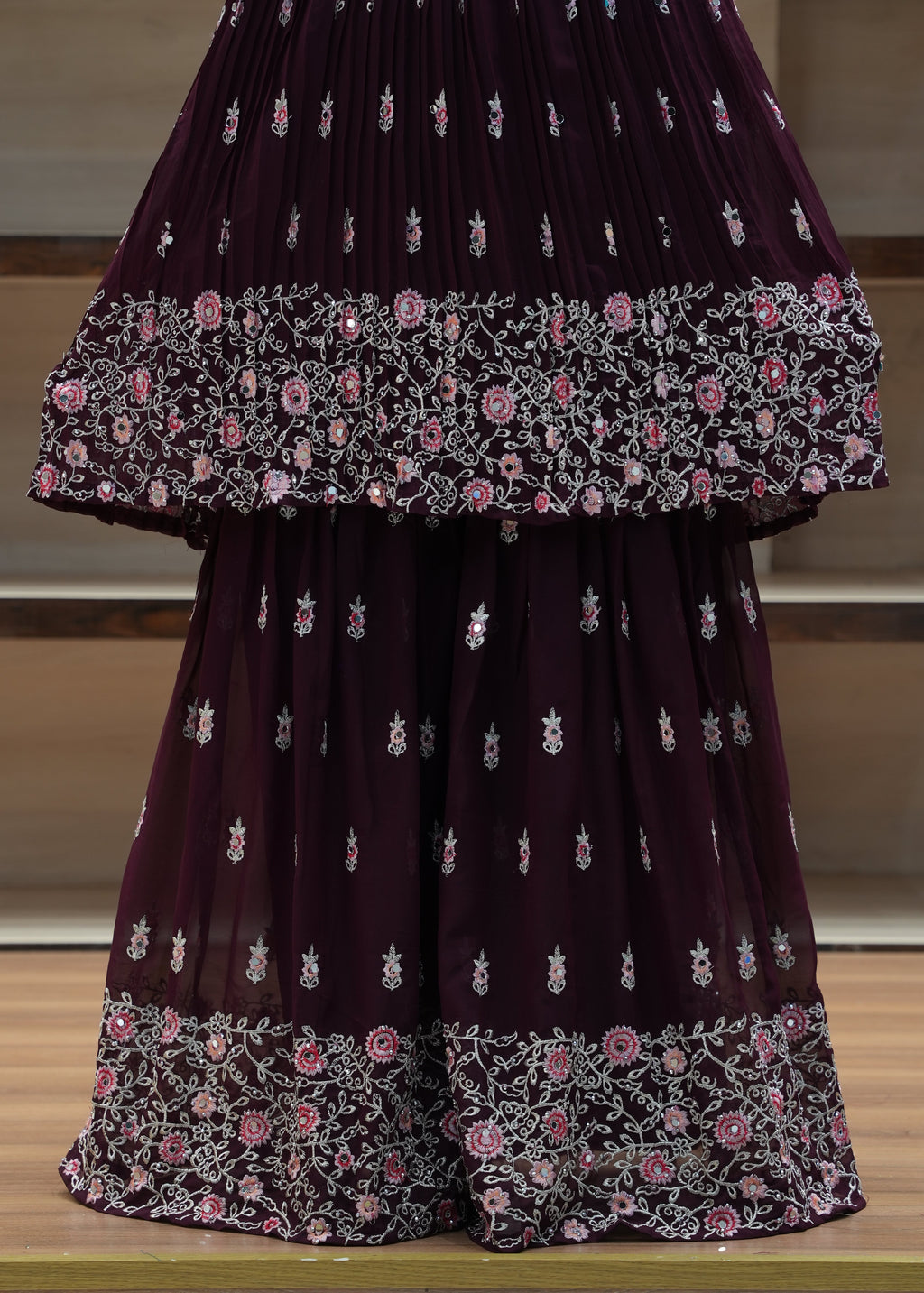 Purple saree with floral patterns on a chair