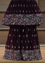 Purple saree with floral patterns on a chair