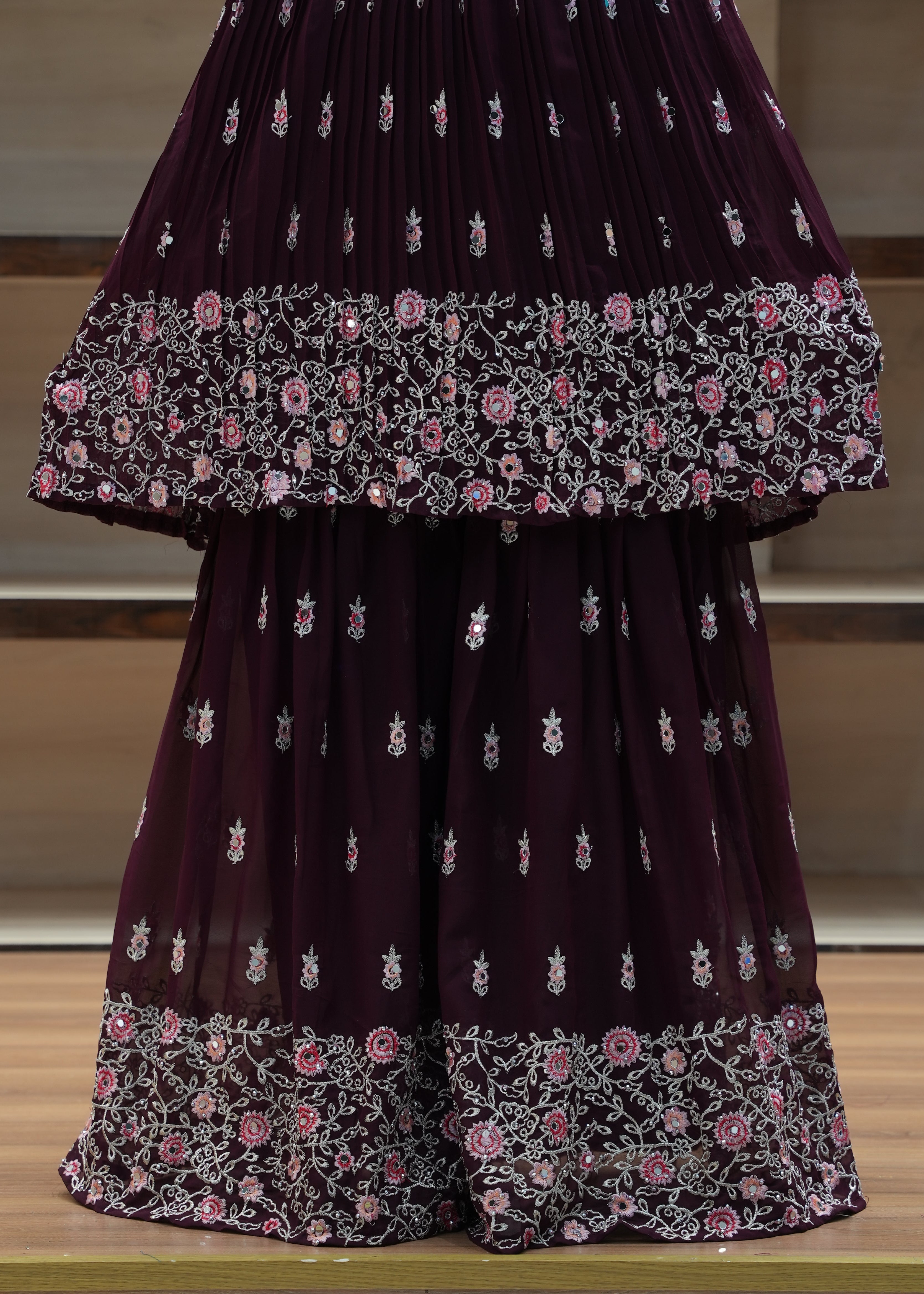 Purple saree with floral patterns on a chair