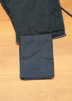 Black jacket with a pocket on a wooden surface