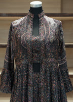 Floral patterned dress on a mannequin with a blurred background