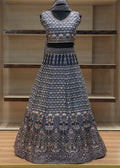 Traditional outfit with a patterned top and skirt on a wooden shelf.