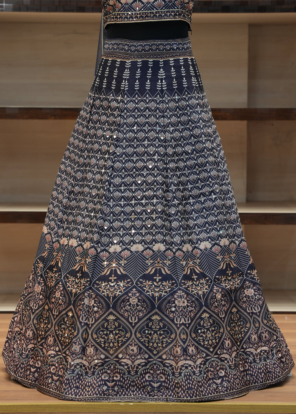 Decorative tablecloth with intricate patterns on a wooden chair.