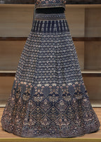 Decorative tablecloth with intricate patterns on a wooden chair.