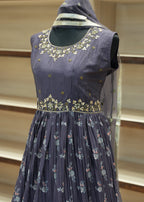 Navy blue embroidered blouse on a mannequin with a neutral background