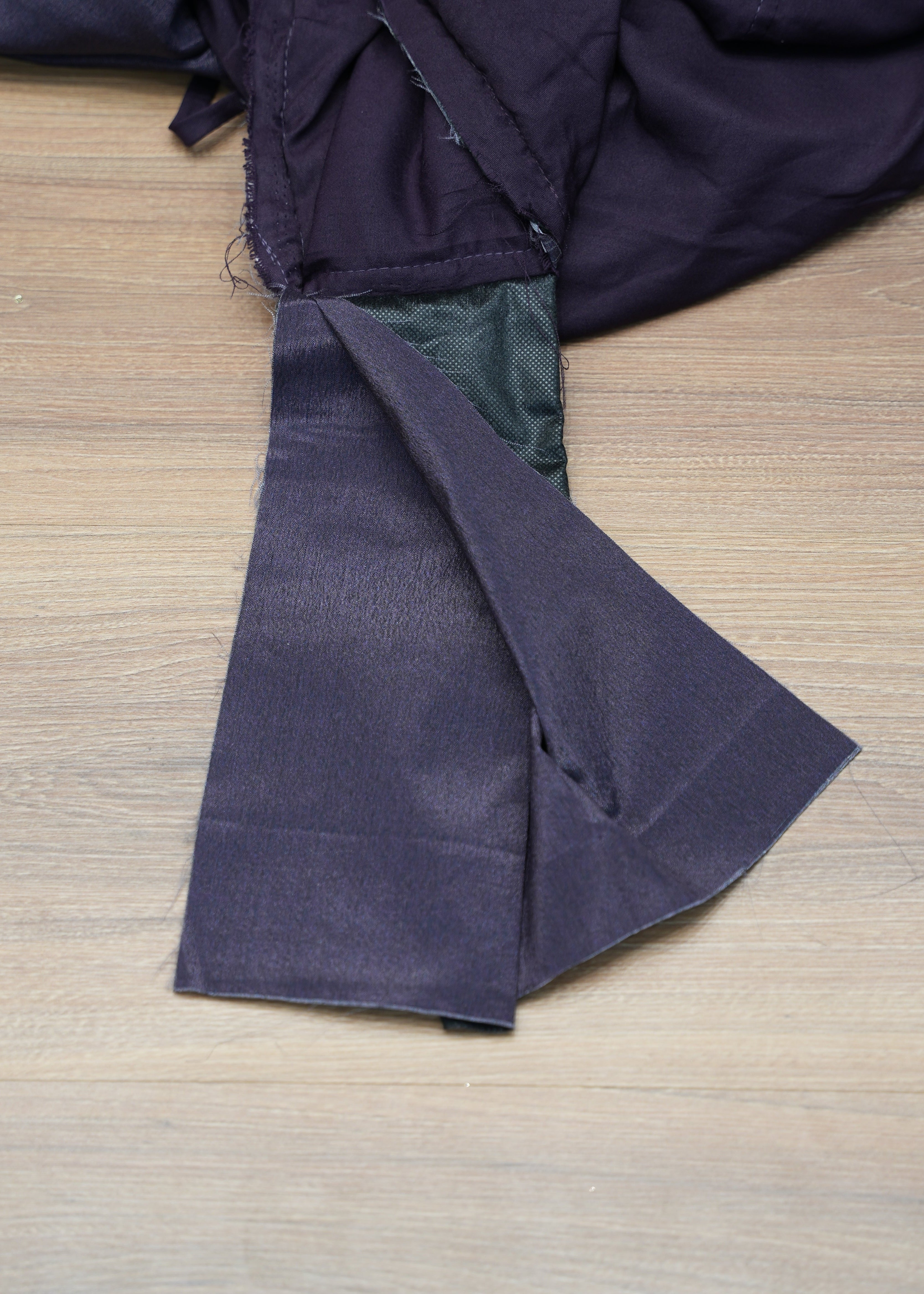 Dark blue fabric on a wooden surface