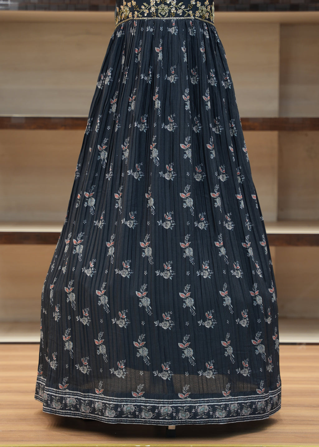 Dark blue fabric with small white patterns on a wooden surface