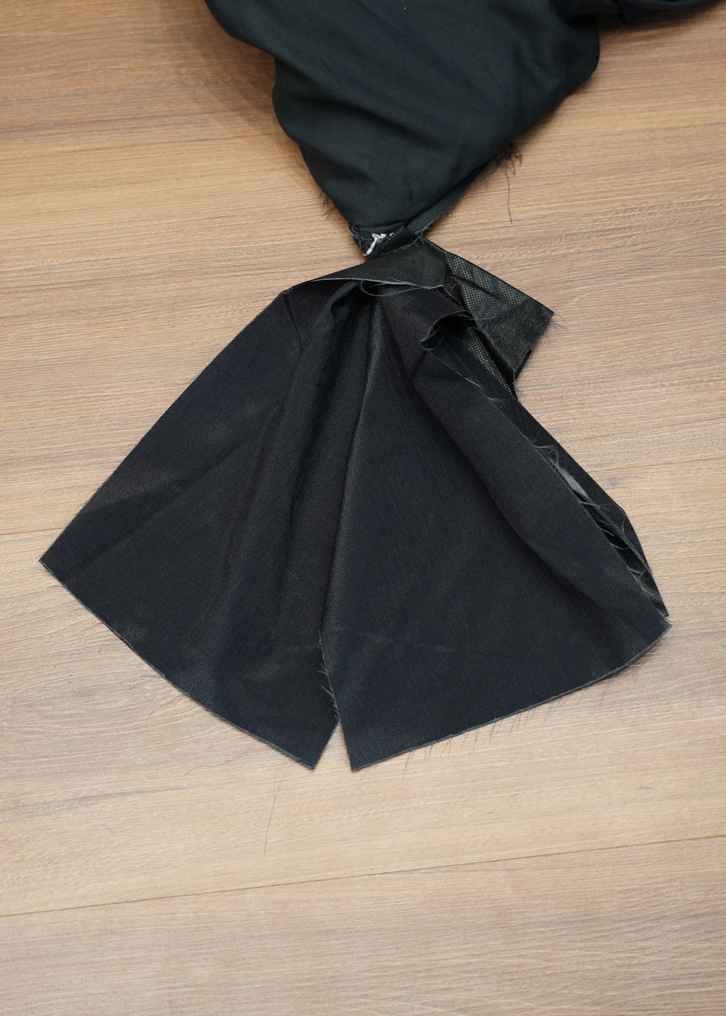 Black fabric on a wooden surface