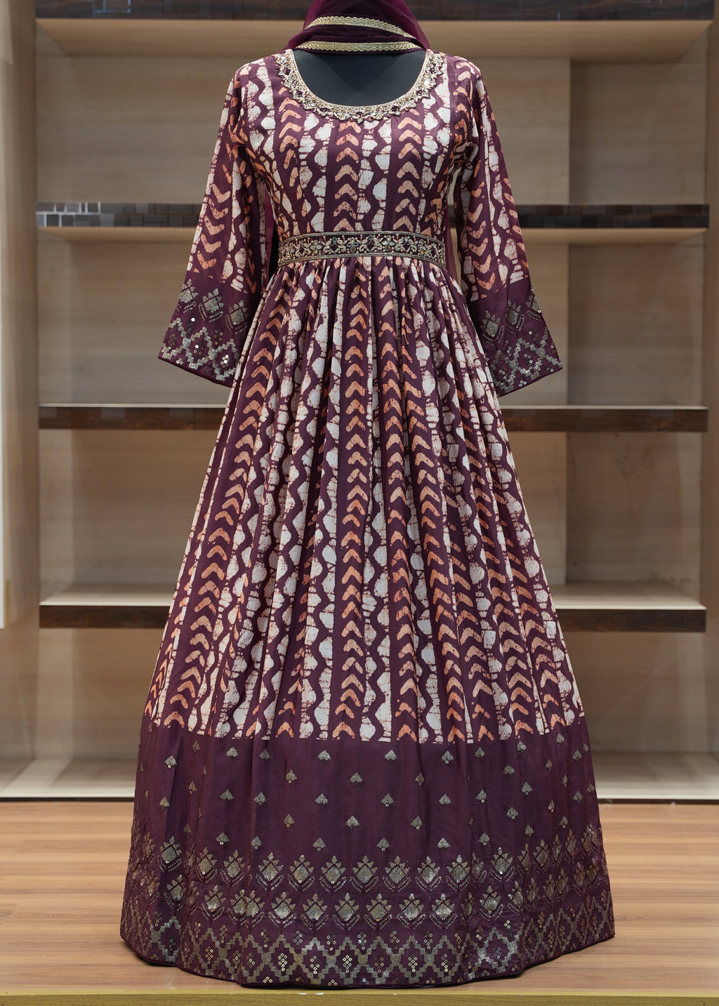 Traditional patterned dress on a wooden shelf