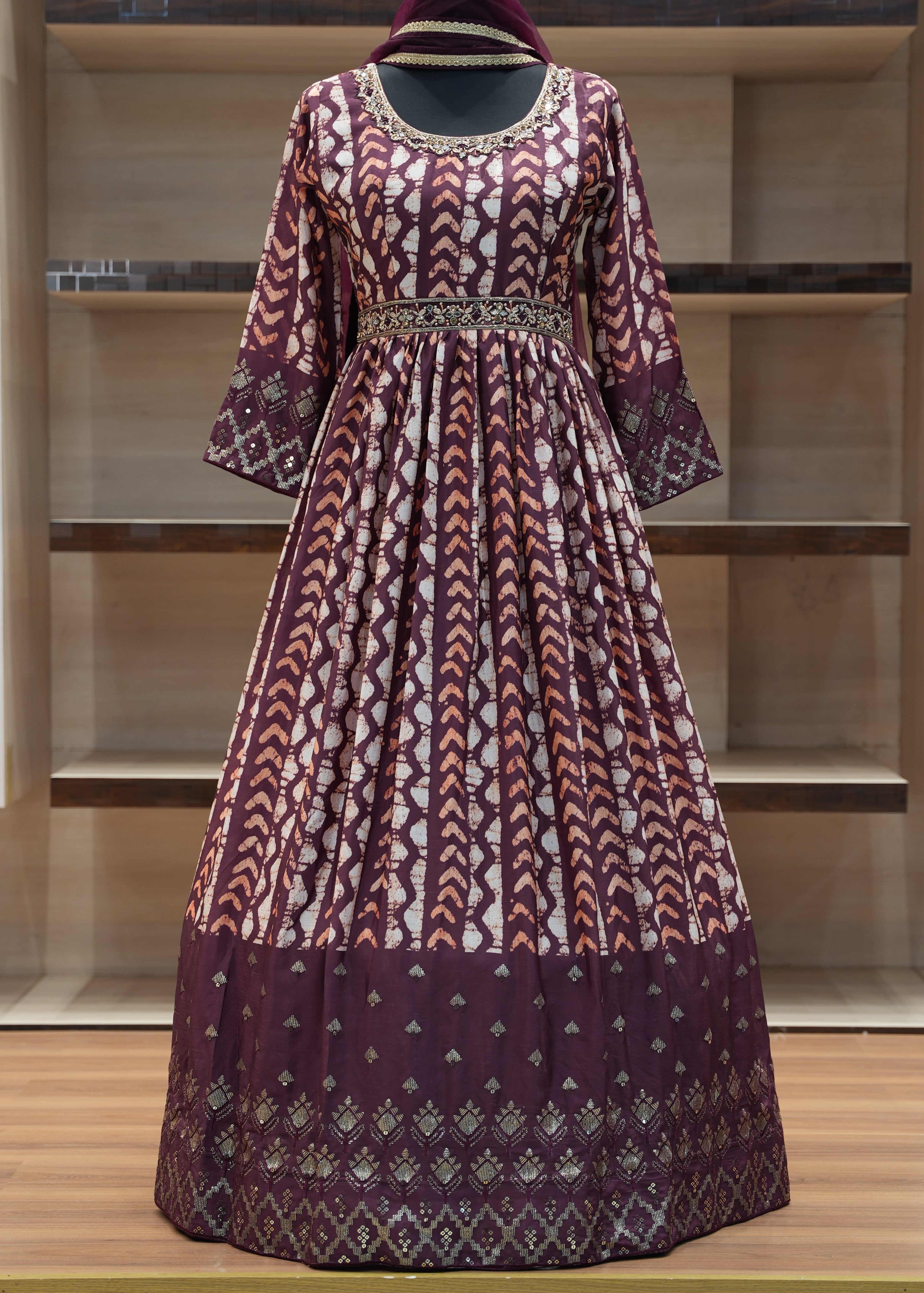 Traditional patterned dress on a wooden shelf