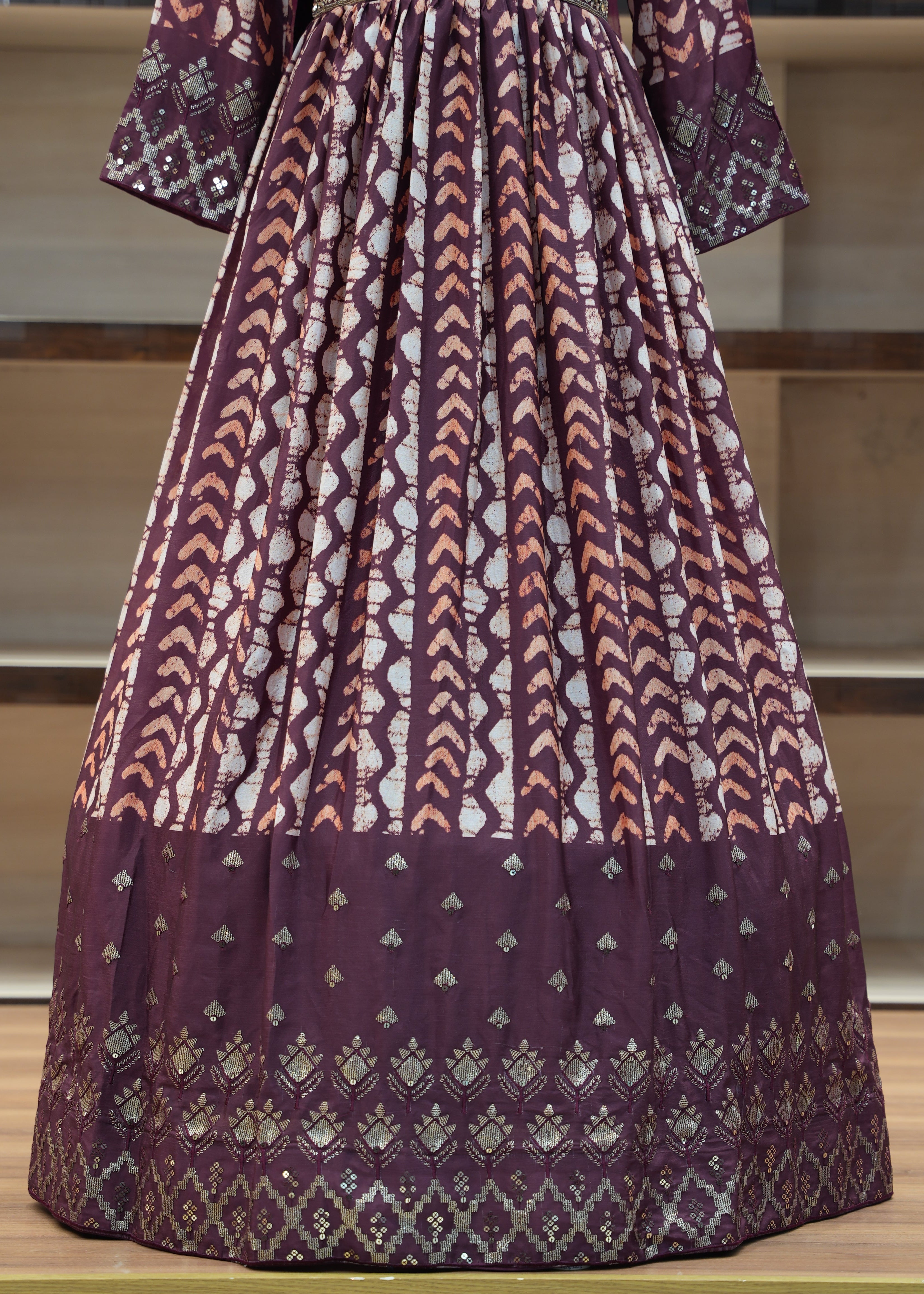 Patterned fabric draped over a chair with a neutral background