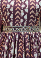 Patterned dress with a decorative belt on a mannequin