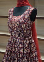 Patterned dress on a mannequin with a blurred background