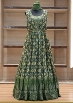Green floral dress on a mannequin against a wooden panel background