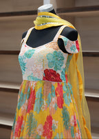 Colorful floral dress on a mannequin against a neutral background
