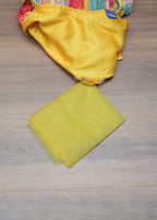 Yellow fabric on a wooden surface