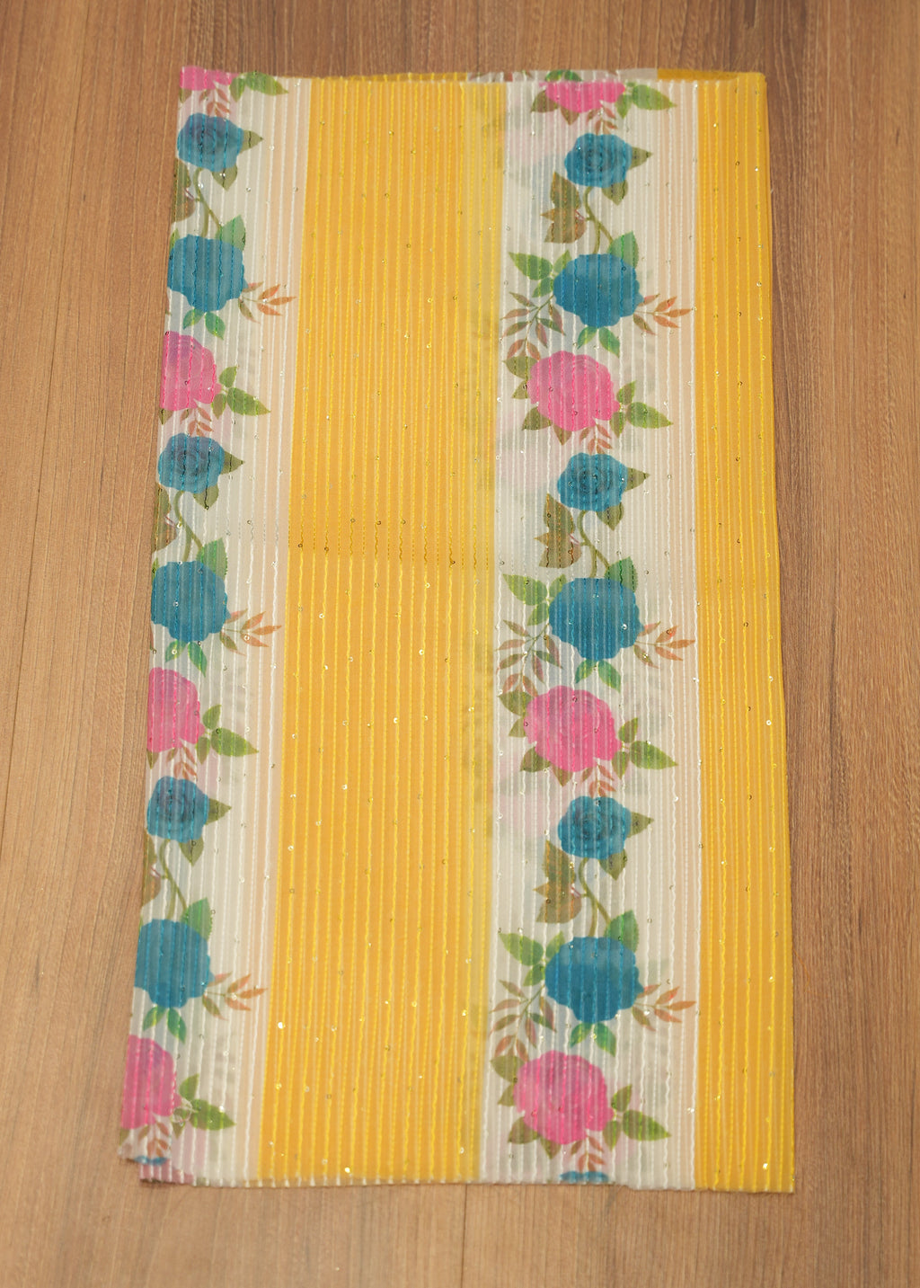 Floral-patterned mat on a wooden surface