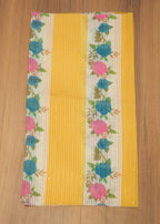 Floral-patterned mat on a wooden surface