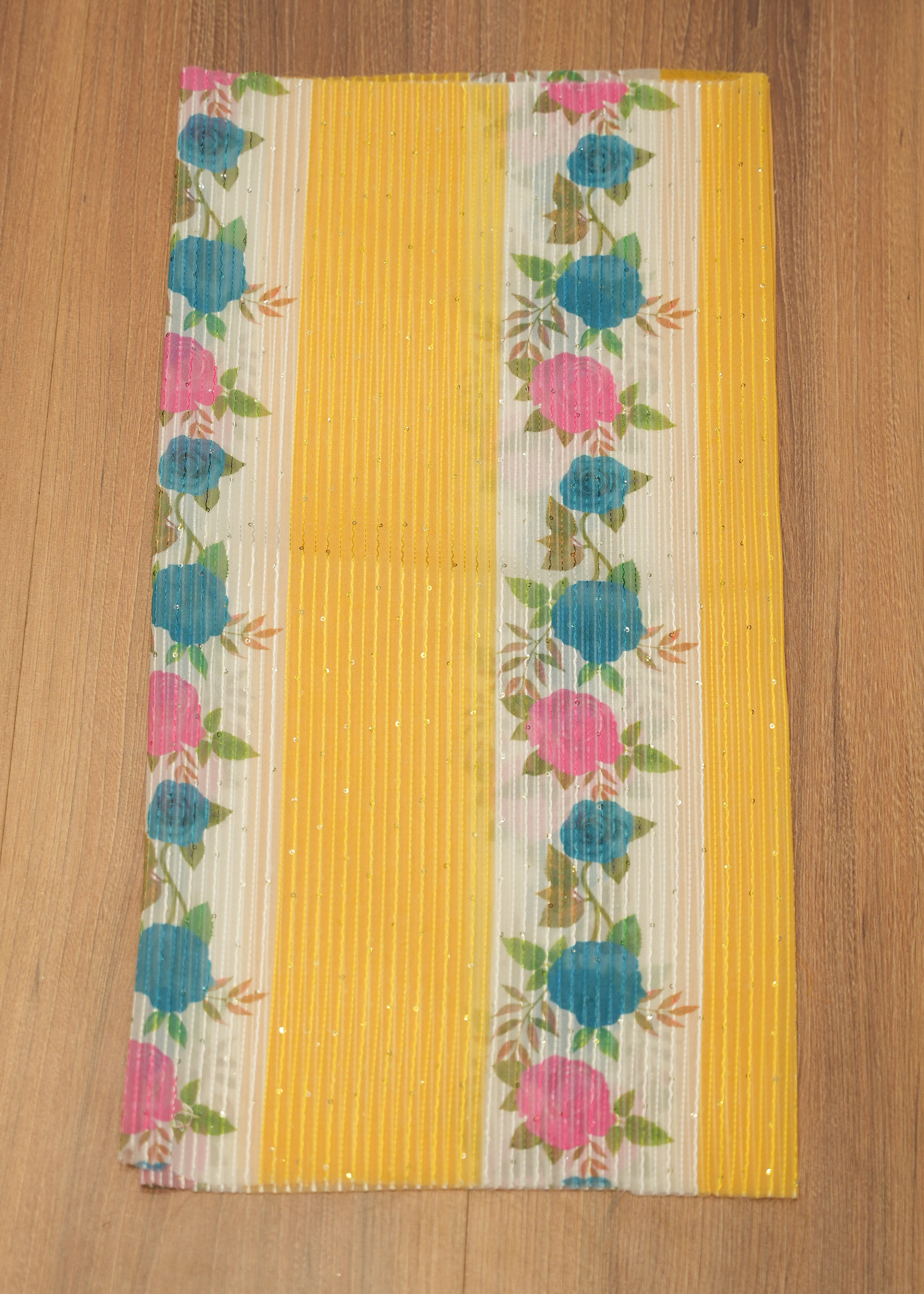 Floral-patterned mat on a wooden surface