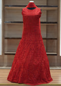 Red lace dress on a mannequin against a modern interior background