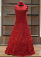 Red lace dress on a mannequin against a modern interior background