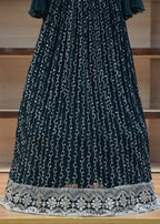Dark blue dress with white chain pattern on a wooden surface