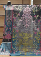 Colorful patterned fabric on a wooden hanger against a wooden background