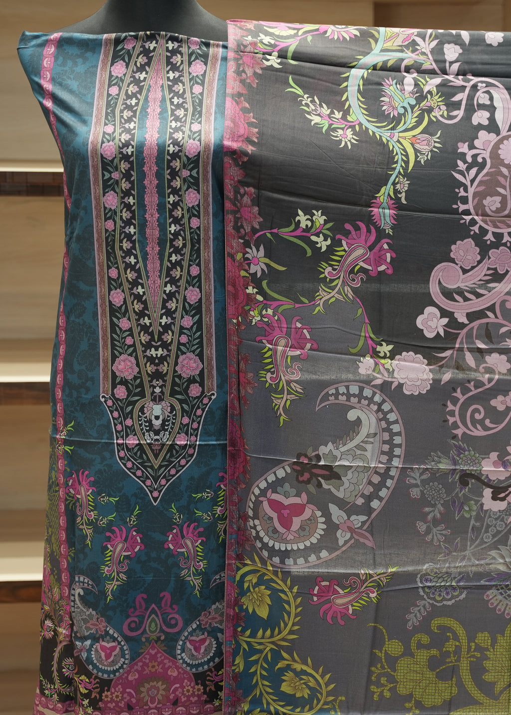 Decorative fabric with intricate paisley pattern on a mannequin
