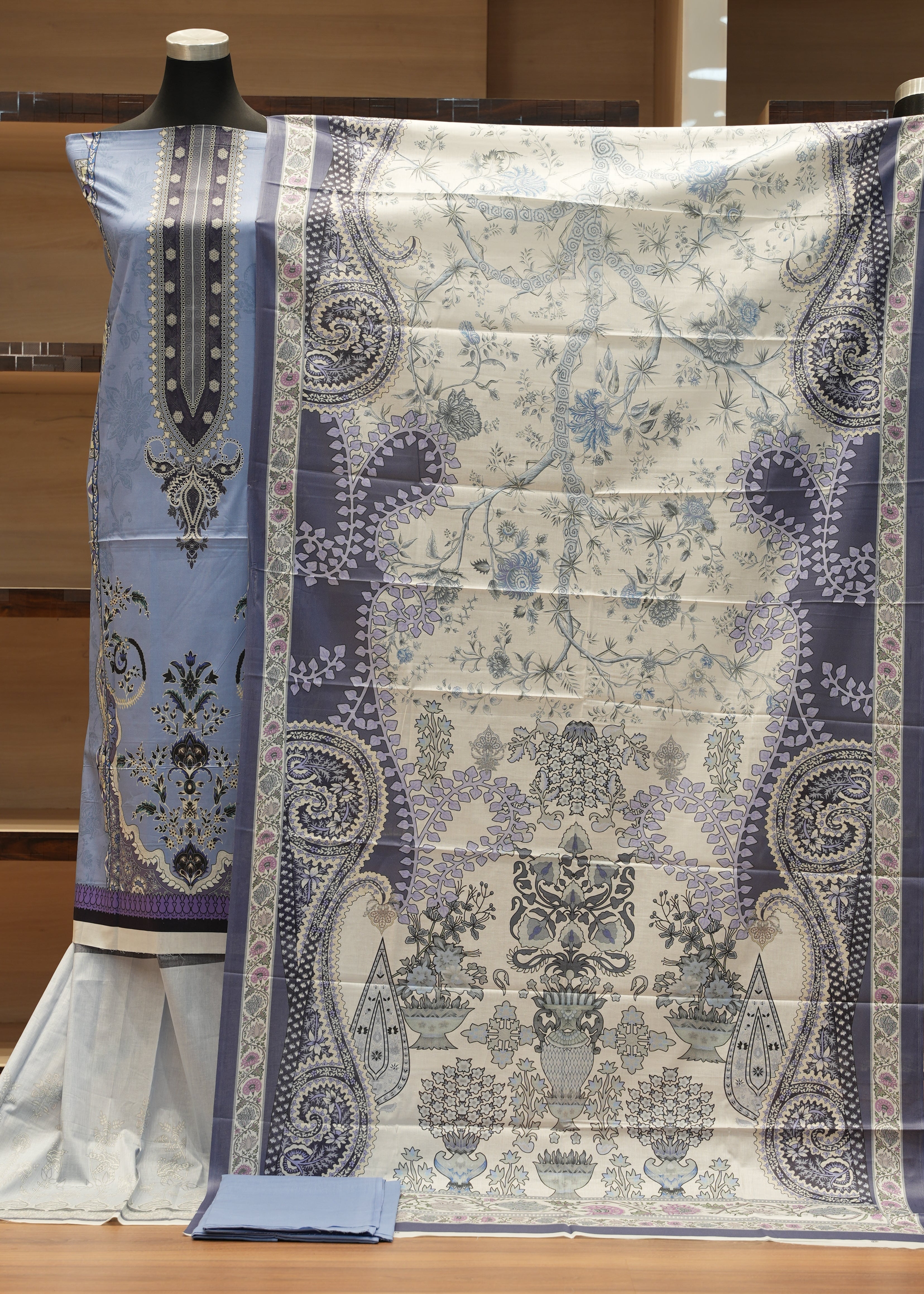 Decorative tablecloth with intricate patterns on a wooden surface