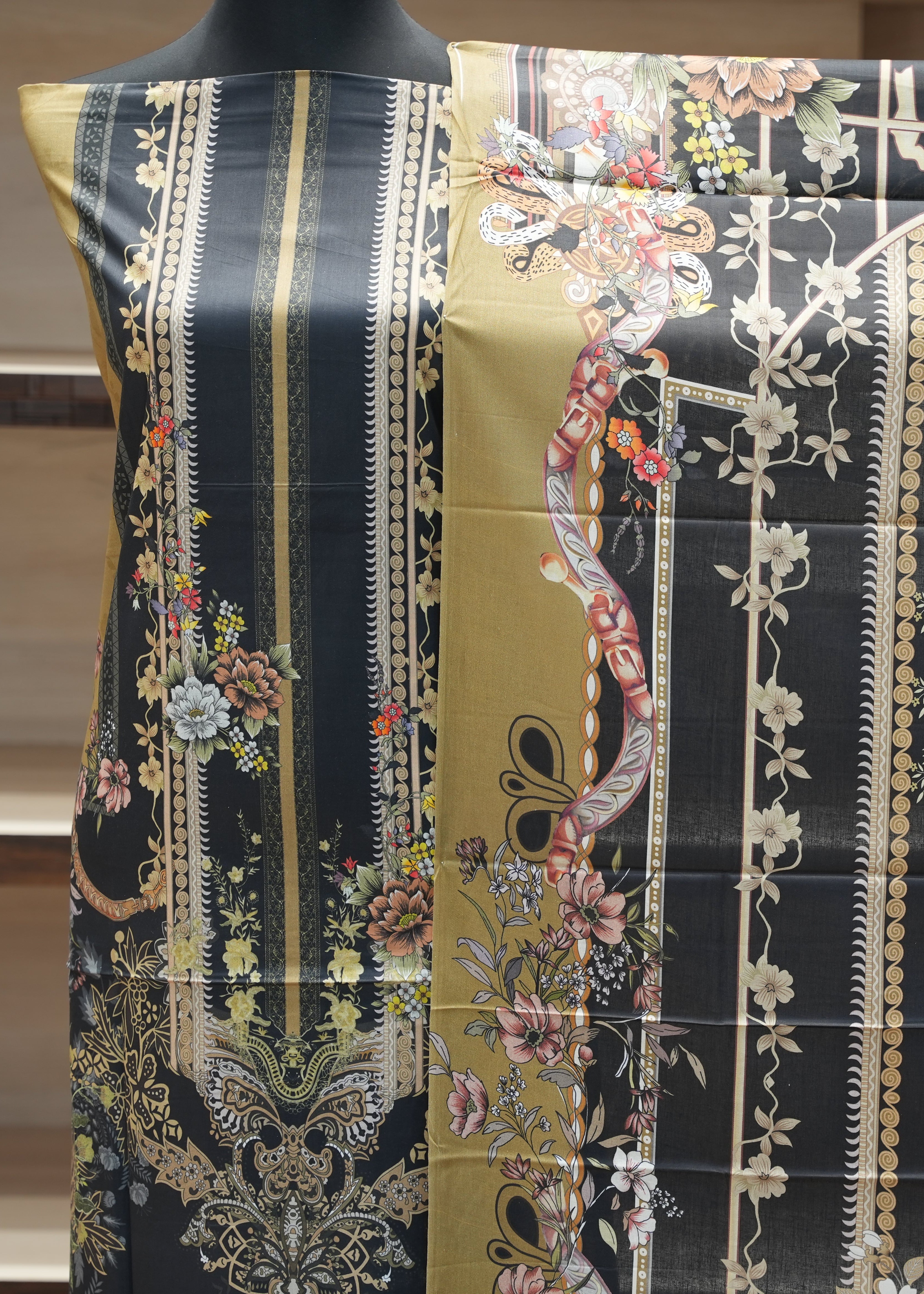 Decorative fabric with intricate patterns on a black background