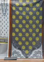 Fabric with yellow polka dots and elephant patterns on a wooden background