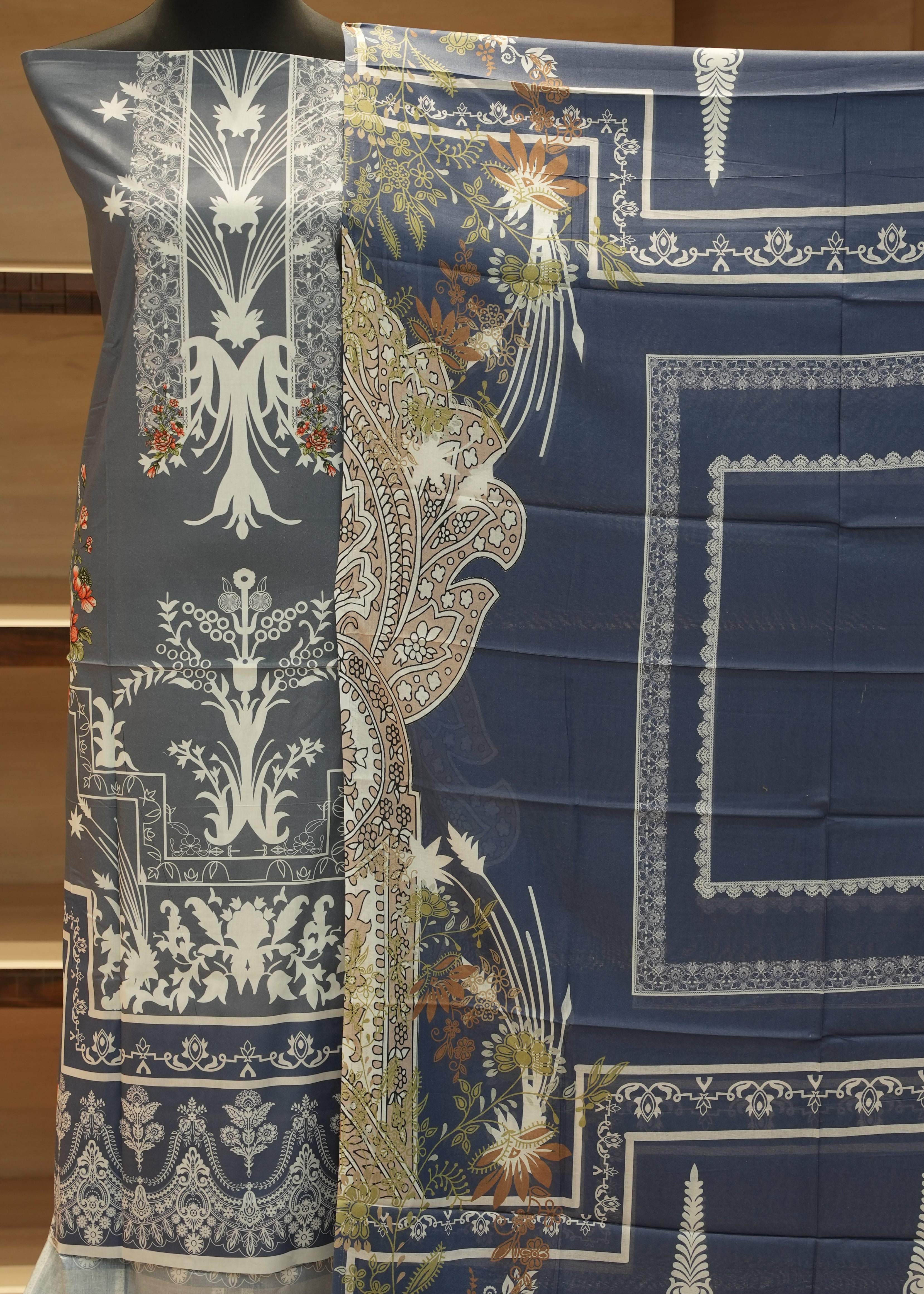 Decorative fabric with intricate patterns on a wooden surface