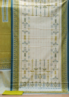 Saree with green and white pattern on a wooden surface