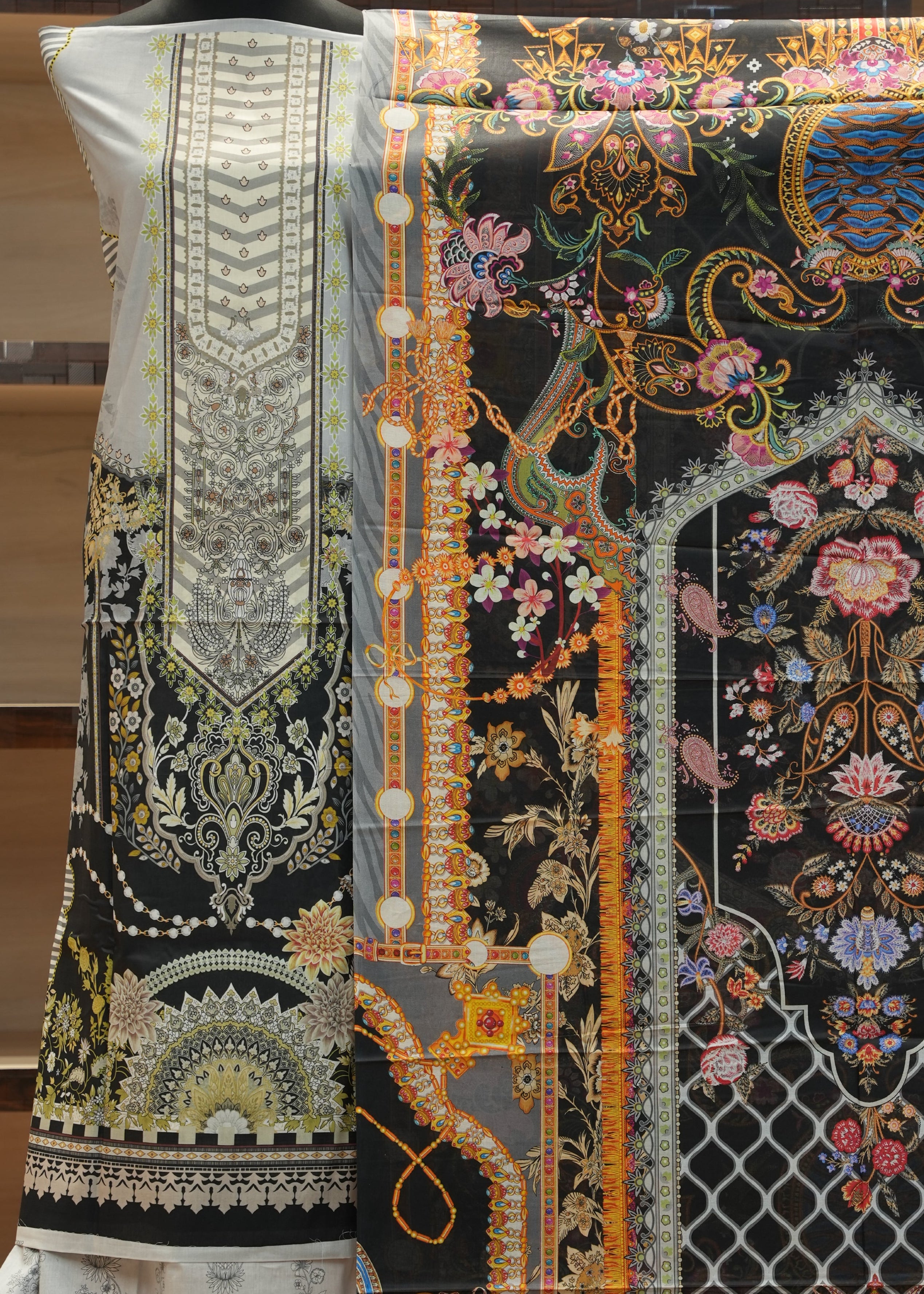 Decorative fabric with intricate patterns on a black background