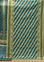 Green and white patterned fabric on a wooden surface