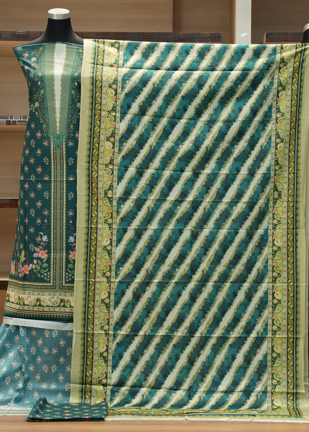 Green and white patterned fabric on a wooden hanger